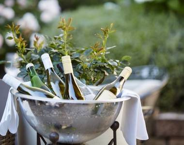 Wine in the champagne cooler on the garden terrace of Hotel Die Reichsstadt in Gengenbach